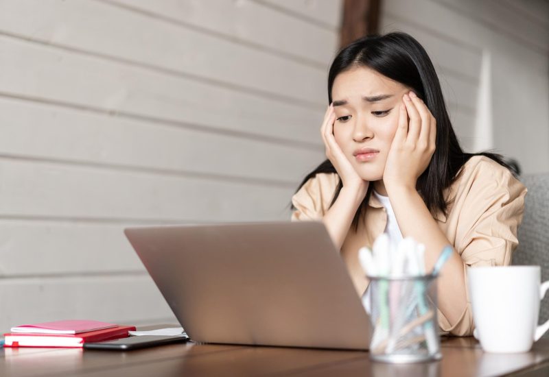 sad-bored-young-asian-girl-student-studying-looking-upset-laptop-screen-attend-boring-online